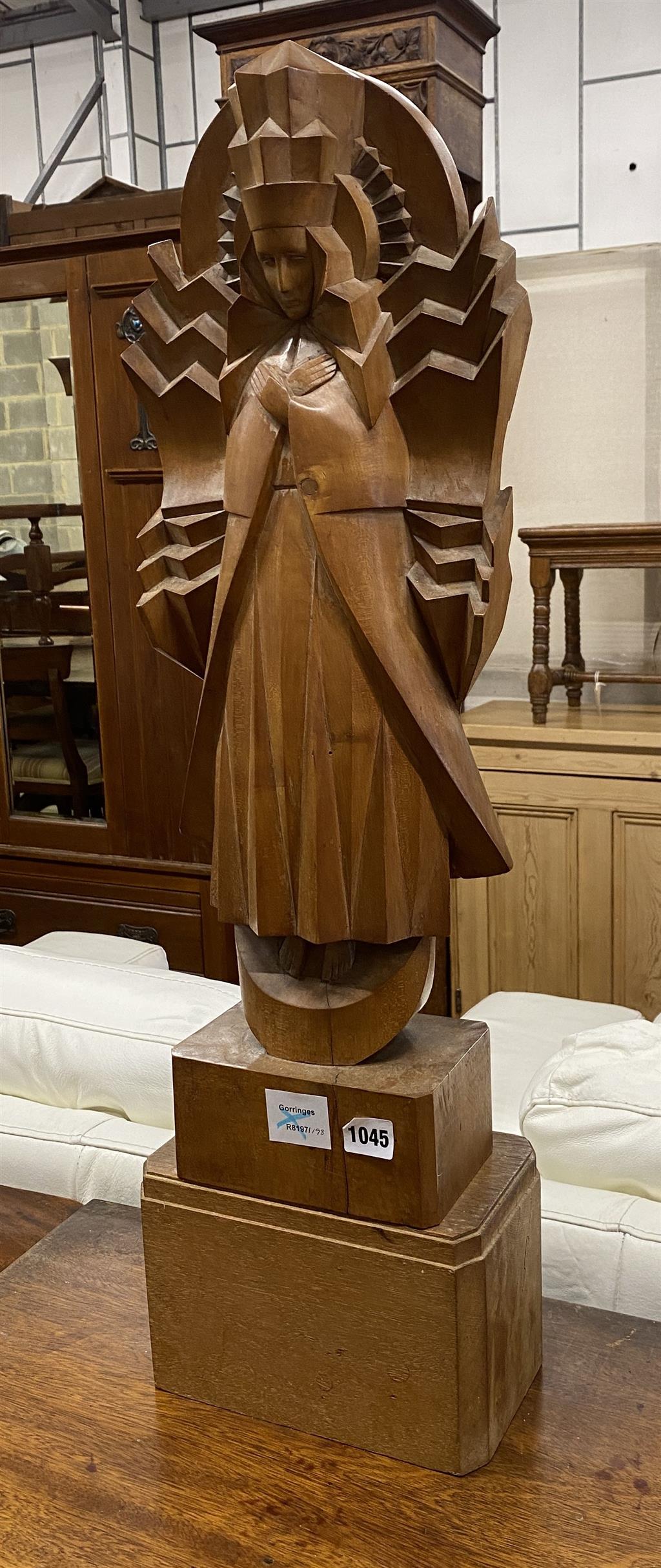 A wooden figure of the Virgin Mary in Art Deco style, on stand width 23cm, depth 14cm, height 78cm